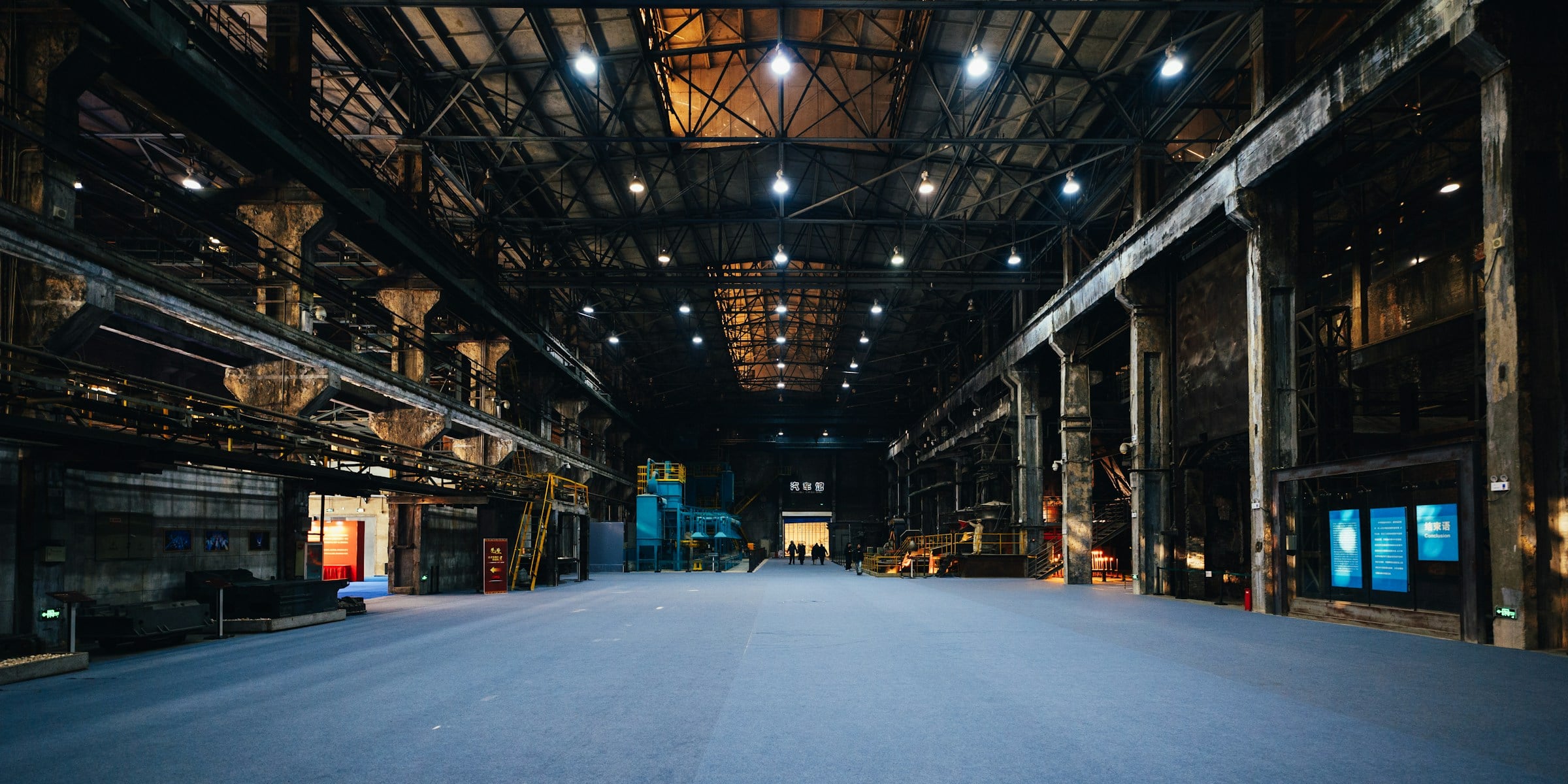 Empty industrial production hall seen down its central aisle